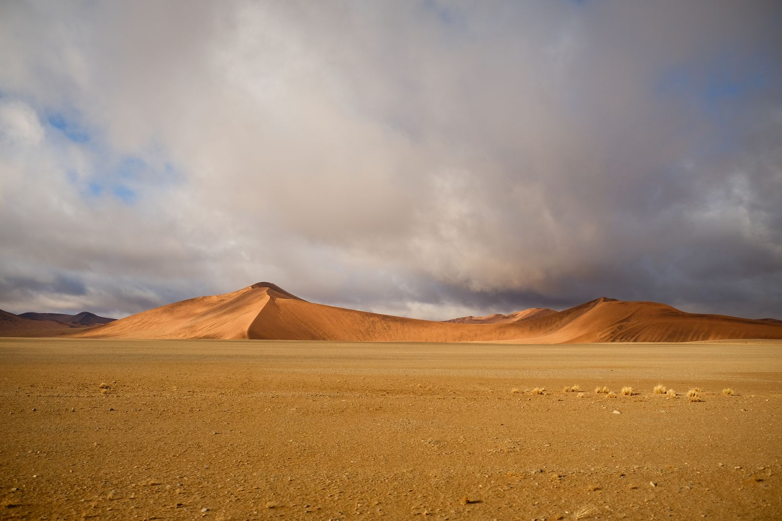 Dramatic sky over Namib desert dunes